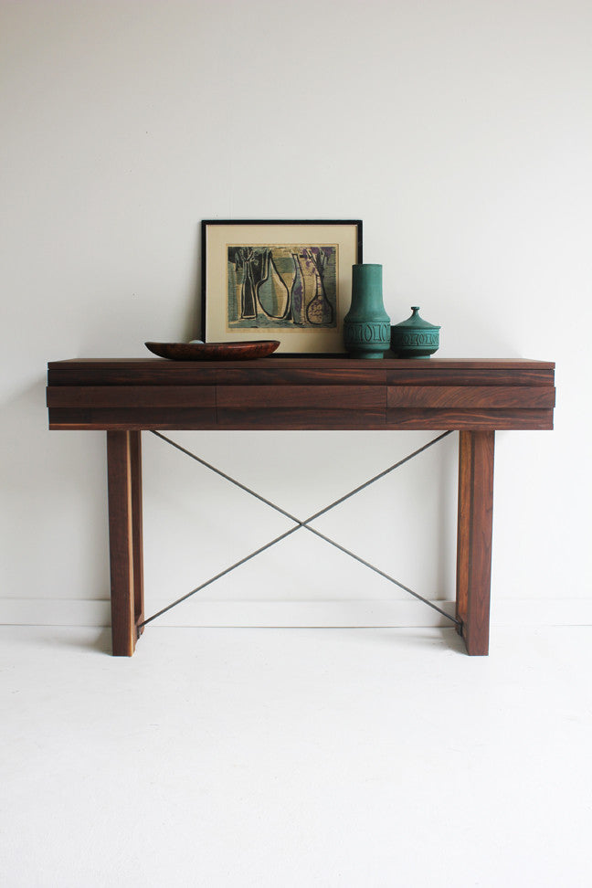 Craft Associates® Console Table in luxury mid century modern walnut, full front view on a plain studio background
